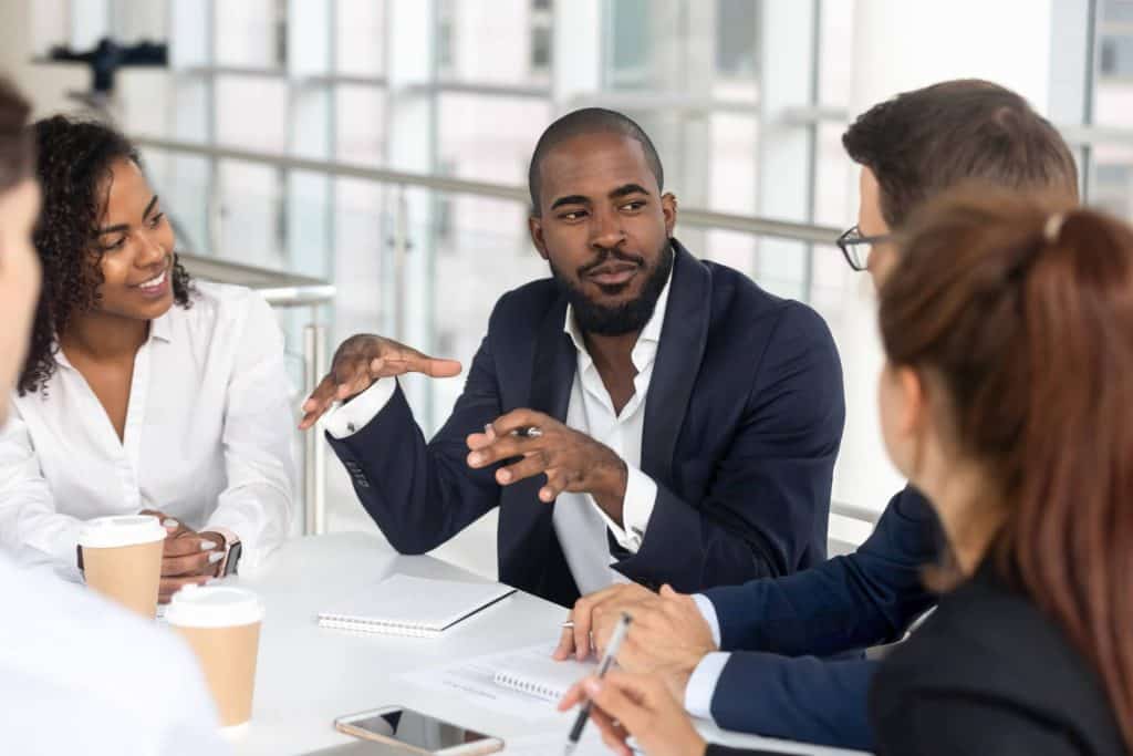 Employees gather in the boardroom to talk about the California Consumer Privacy Act (CCPA) that will take effect in the new year.